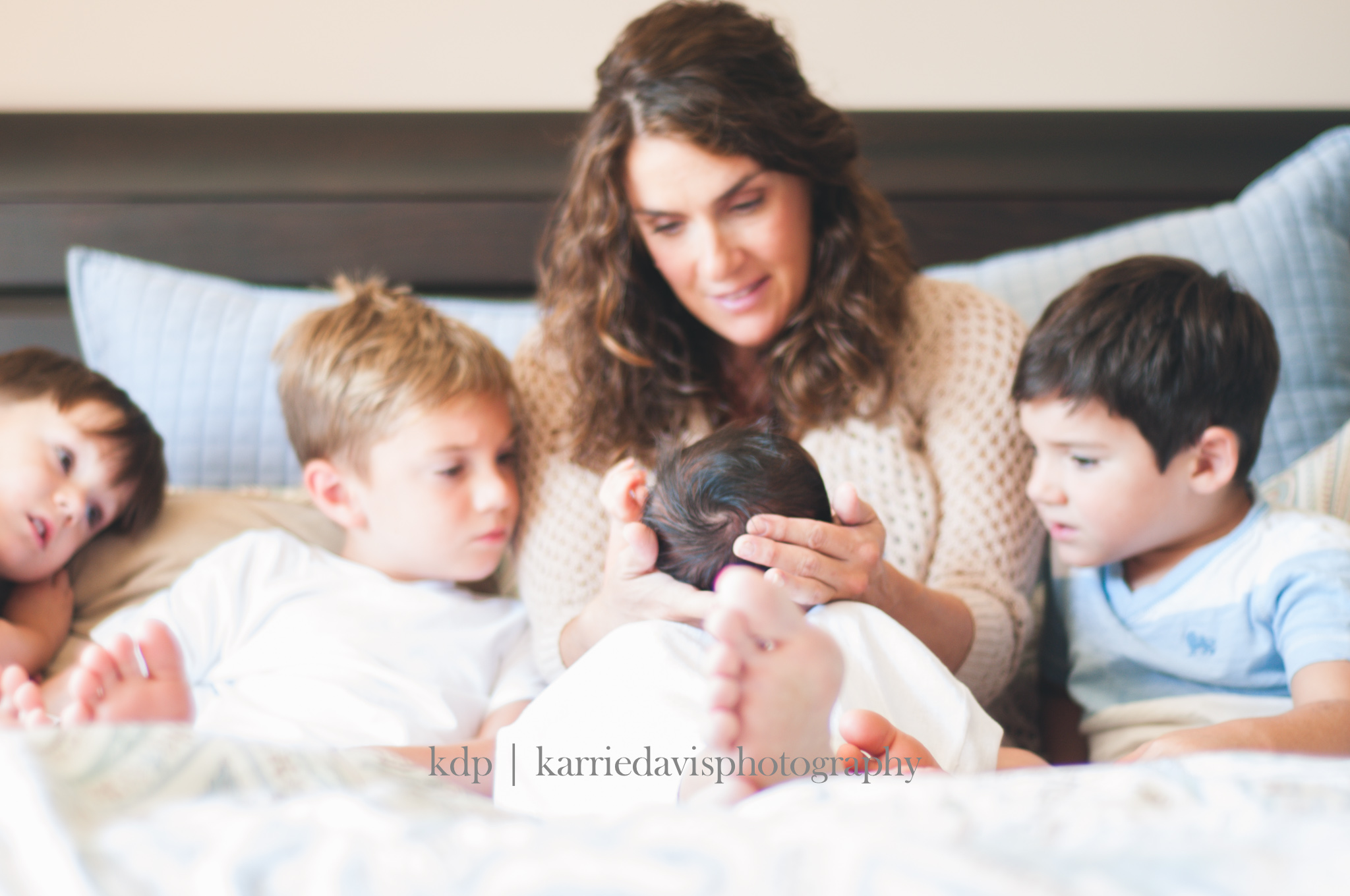 newborn with brothers