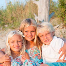 brother and sister beach hug