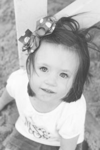sandy face girl on beach