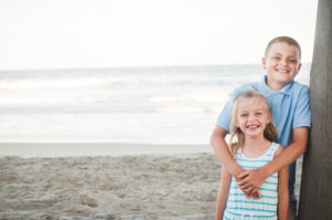 brother hugs sister