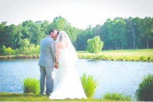 beautiful outdoor photo bride and groom by the water
