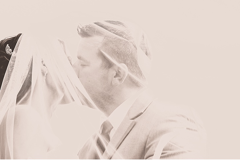 sepia photo bride and groom with veil