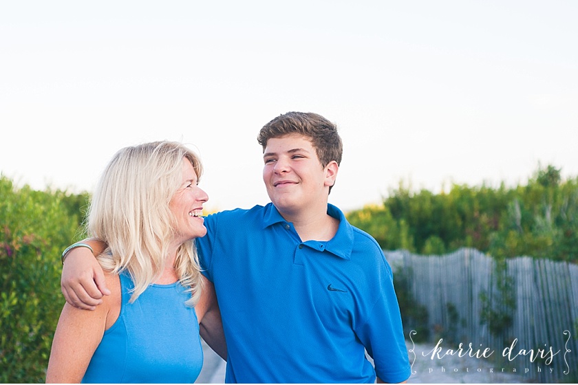 sweet candid photo of mom and her teen son.