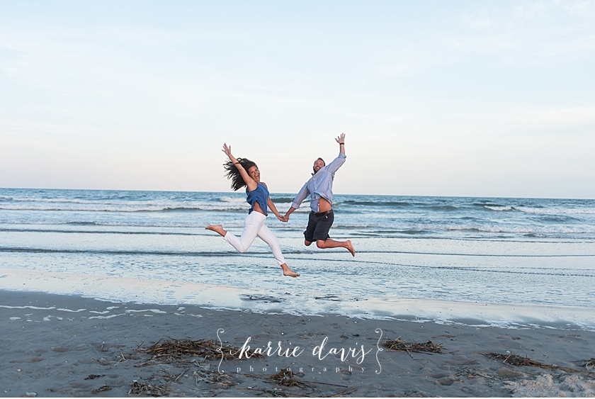 fun pose idea for engagement photos on the beach