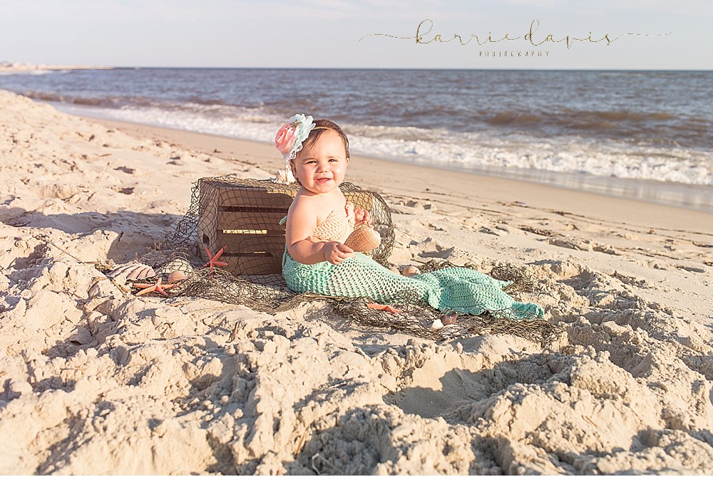 baby girl in mermaid outfit at the beach in Cape May NJ 
