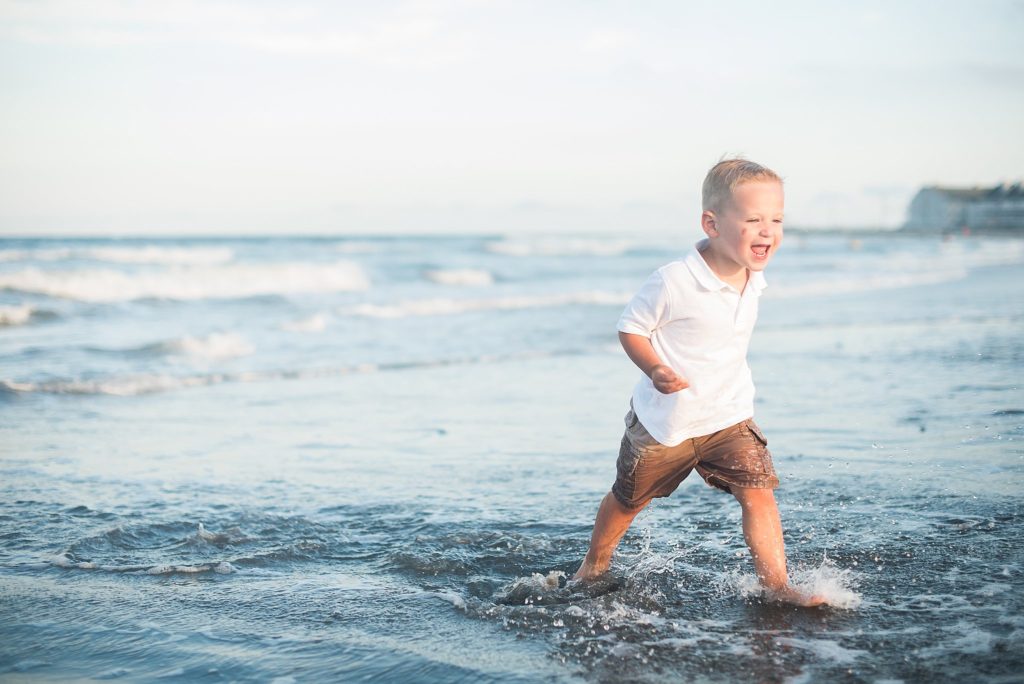 brothers at the beach in ocean