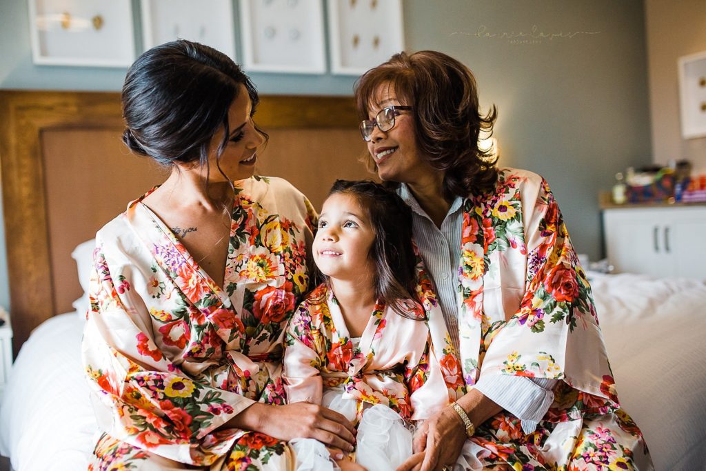 Silk robes for the bride, flower girl, and mother of the bride make a fun extra thought when getting ready for a wedding.