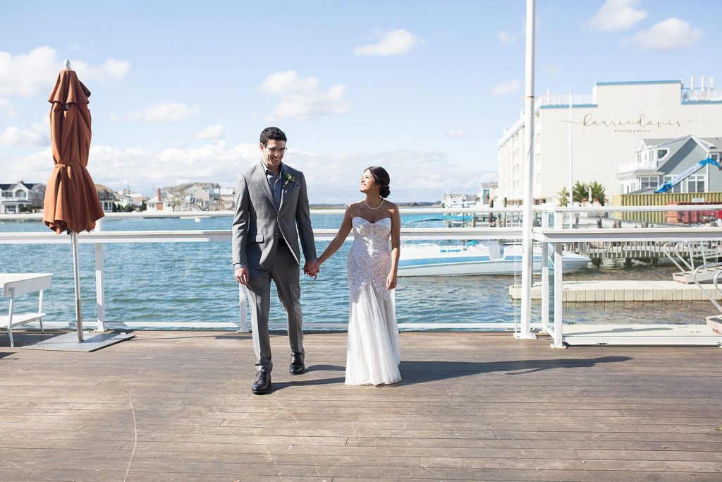 A coastal and intimate wedding at the Reeds of Shelter Haven in Stone Harbor, NJ. by Karrie Davis Photography Studios.